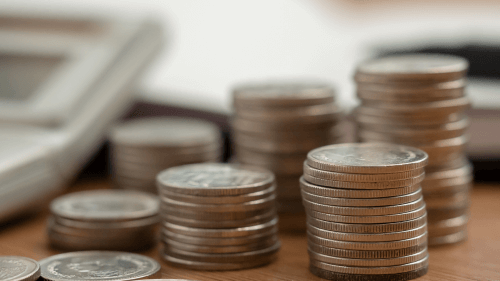 abono salarial do PIS/PASEP - moedas e calculadora