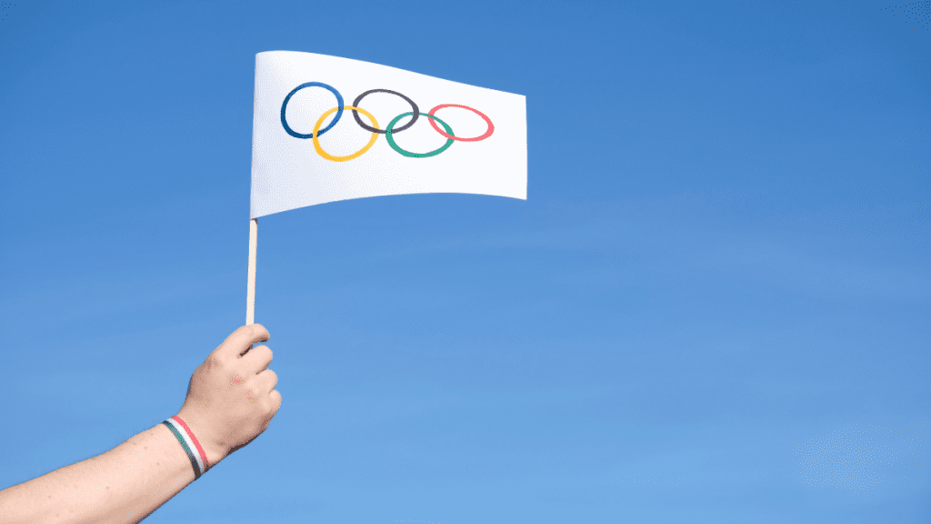 importância dos Jogos Olímpicos - bandeira com os aneis olímpicos